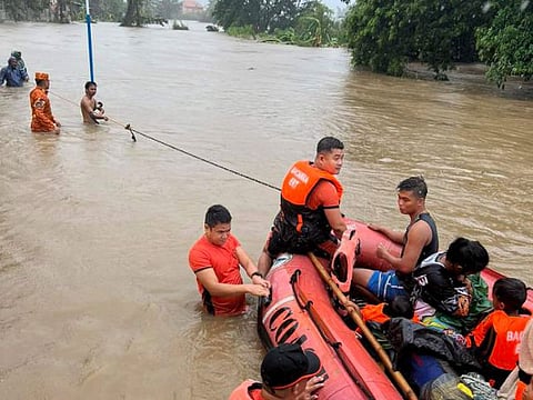 Typhoon Doksuri ripped off tin roofs from homes, engulfed low-lying villages in flood, knocked down power and displaced more than 12,000 people Wednesday as it smashed into a small island and lashed northern Philippine provinces overnight with ferocious wind and rain, officials said.