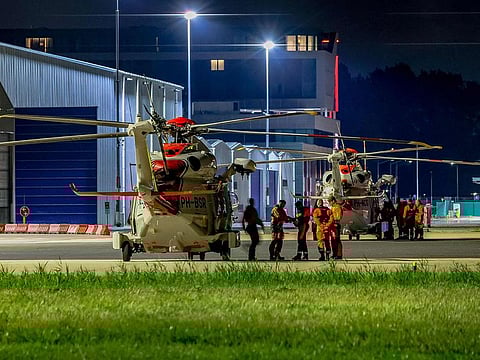Coast Guard helicopters involved in the rescue operation on the ship Fremantle Highway are seen on the tarmac at Rotterdam The Hague Airport, the Netherlands, after a fire, which killed at least one sailor on July 26, 2023.