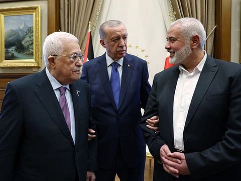 Turkish President Recep Tayyip Erdogan (centre) meeting with Palestinian President Mahmoud Abbas (left) and the leader of the Palestinian Hamas movement Ismail Haniya at the Presidential Complex in Ankara.