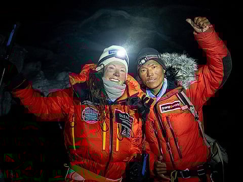 Norwegian climber Kristin Harila (L) and Nepali guide Tenjin Sherpa at Kanchenjunga, the third-highest mountain in the world located in Nepal. (Handout photo taken on May 18, 2023 and released by Courtesy of Field Productions)