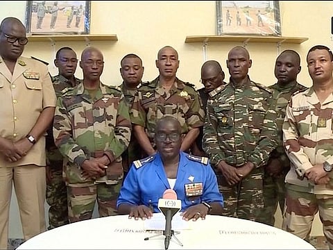 Niger Army spokesman Colonel Major Amadou Adramane speaks during an appearance on national television, after President Mohamed Bazoum was held in the presidential palace, in Niamey, Niger, on July 26, 2023 in this still image taken from video.