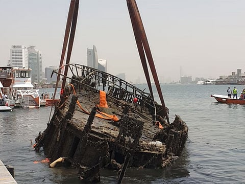 Dubai Municipality retrieves marine debris including nine wooden cruise and commercial vessels from the Dubai Creek