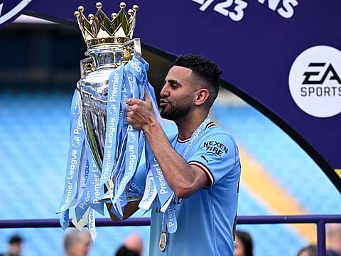 (FILES) Manchester City's Algerian midfielder Riyad Mahrez poses with the Premier League trophy after the presentation ceremony following the English Premier League football match between Manchester City and Chelsea at the Etihad Stadium in Manchester, north west England, on May 21, 2023