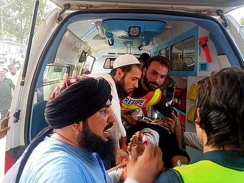 An injured being moved to a hospital after a bomb blast at a Jamiat Ulema Islam-Fazl (JUI-F) convention in Khyber Pakhtunkhwa’s Bajaur district on July 30.