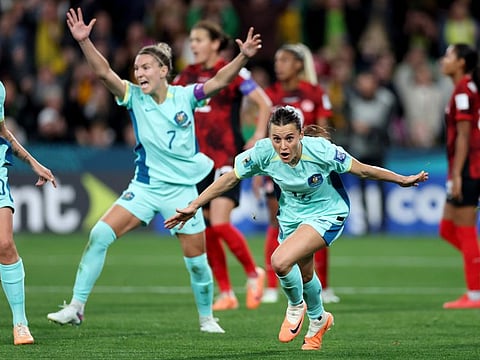 Australia's Hayley Raso (right) celebrates after scoring her side's second goal during the Women's World Cup Group B against Canada in Melbourne on Monday.