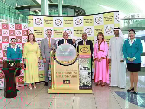 Dubai Duty Free representatives with the million-dollar winning ticket during Wednesday's draw at the airport