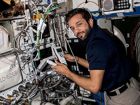 Al Neyadi performing maintenance on the Space Automated Bioproduct Laboratory inside the International Space Station