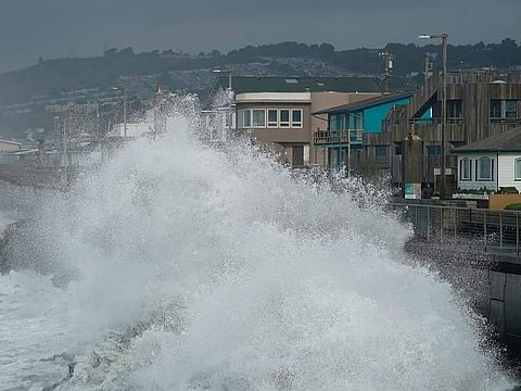 Large waves crash into a seawall in Pacifica, California.