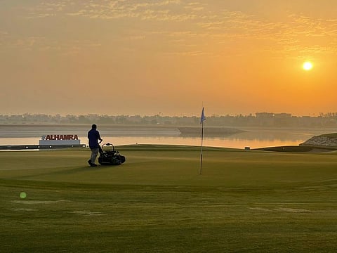 Greenkeeper at work at Al Hamra Golf Club in Ras Al Khaimah