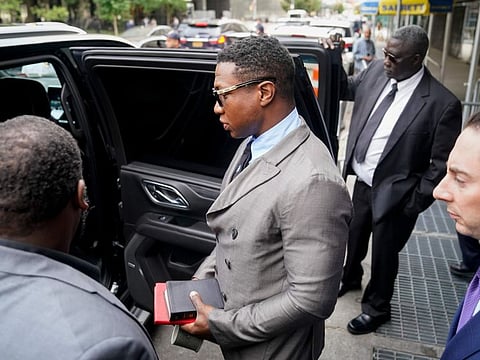 Jonathan Majors leaves court after a hearing on his domestic violence case, on Aug. 3, 2023, in New York.