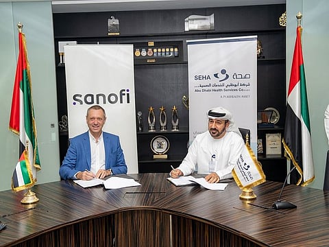 Saeed Jaber Al Kuwaiti, Group Chief Executive Officer of SEHA (right) and Jean-Paul Scheuer, MCO Lead and Specialty Care General Manager at Sanofi during the agreement signing ceremony