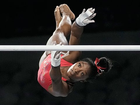Simone Biles, a seven-time Olympic medalist and the 2016 Olympic champion, practicers on the uneven bars at the US Classic gymnastics competition on Friday, in Hoffman Estates, Illinois.