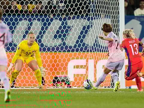 Japan's Hinata Miyazawa scores her side's third goal against Norway's goalkeeper Aurora Mikalsen during the Women's World Cup match in Wellington, New Zealand, on Saturday.