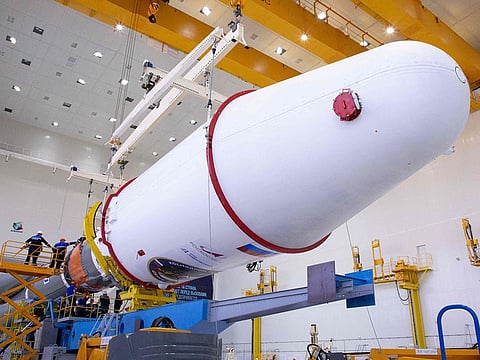 Technicians finishing to assemble a Soyuz 2.1b rocket carrying the Luna-25 lander ahead of its launch scheduled for August 11, 2023.