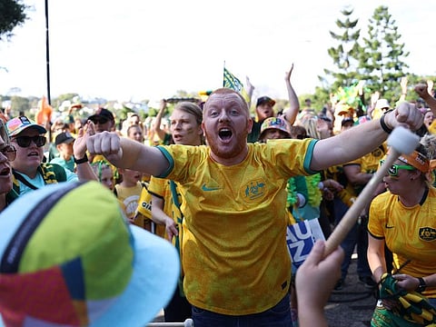 Australia supporters cheer outside the venue before the start of the 2023 Women's World Cup quarter-final football match between Australia and France at Brisbane Stadium in Brisbane on August 12, 2023