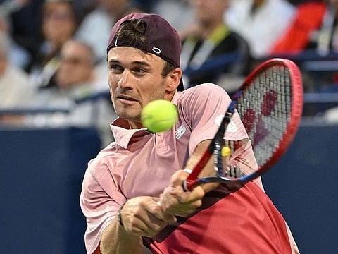 Tommy Paul plays a shot against Carlos Alcaraz (not pictured) during the ATP Toronto Masters quarterfinal matchat Sobeys Stadium.