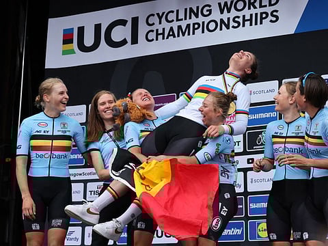 Belgium's Lotte Kopecky celebrates winning gold with her teammates in the women's Elite Road Race during the UCI Cycling World Championships in Glasgow, Scotland on Sunday.