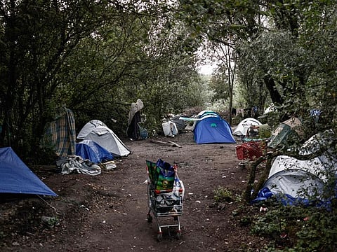 This photograph taken on August 12, 2023, shows tents of migrants installed at a makeshift camp in Loon-Plage, northern France. Six people have been killed as a boat carrying migrants heading to Britain sank in the Channel. Five French ships and a helicopter, as well as two British vessels, were involved in a rescue operation while some passengers were still missing, and about 50 migrants were rescued, some of them by the British vessels, the authorities said.
