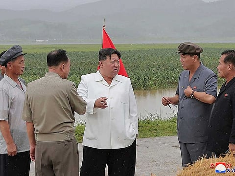 In this undated photo provided on Monday, Aug. 14, 2023, by the North Korean government, North Korean leader Kim Jong Un, centre, visits storm Khanun-hit area at Anbyon County of Kangwon Province, North Korea.