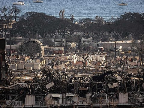Charred remains of a burned neighbourhood is seen in the aftermath of a wildfire, in Lahaina, western Maui, Hawaii on August 14, 2023.