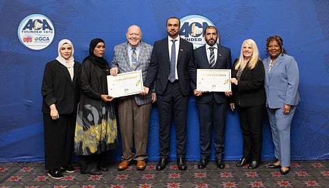 Officials from the General Department of Correctional and Punitive Establishments of Dubai Police receiving accreditation certificates from the ACA officials.