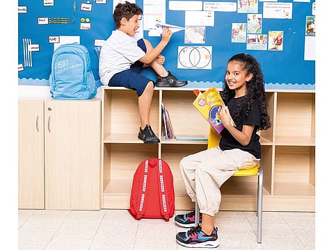 Blue bag Dh189; boy's shoes Dh279; red bag Dh129; girl's shoes Dh349