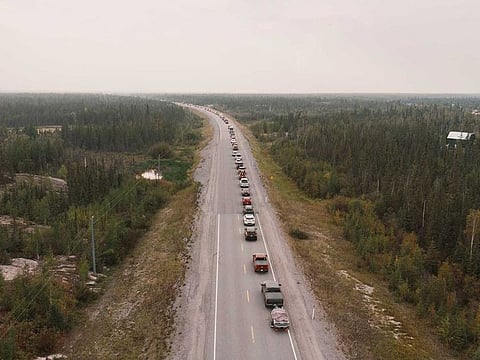 Yellowknife residents leave the city on Highway 3, the only highway in or out of the community, after an evacuation order was given due to the proximity of a wildfire in Yellowknife, Northwest Territories, Canada August 16, 2023.