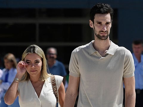 PSG Spanish goalkeeper Sergio Rico leaves the Virgen del Rocio hospital with his wife Alba Silva (L), in Seville on August 18, 2023.
