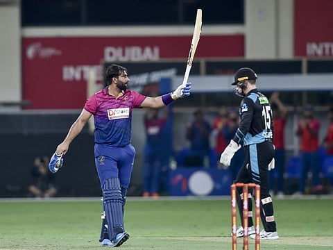 Muhammad Waseem of UAE celebrates his half century during the T20 International against New Zealand at the Dubai International Cricket Stadium on Saturday.