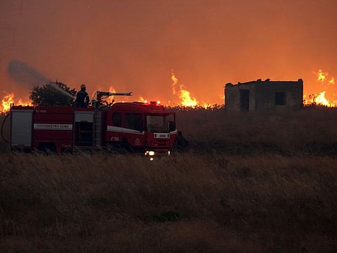 A firefighter operates during a wildfire near the northeastern town of Alexandroupolis, Greece.