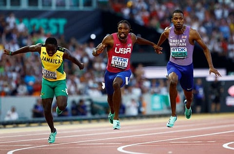 Noah Lyles of the US wins the Men's 100m final alongside Britain's Zharnel Hughes and Jamaica's Oblique Seville at the National Athletics Centre, Budapest, Hungary on Sunday.