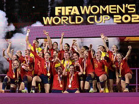 Spain's players celebrate with the trophy after winning the Women's World Cup final against England at Stadium Australia in Sydney on Sunday.