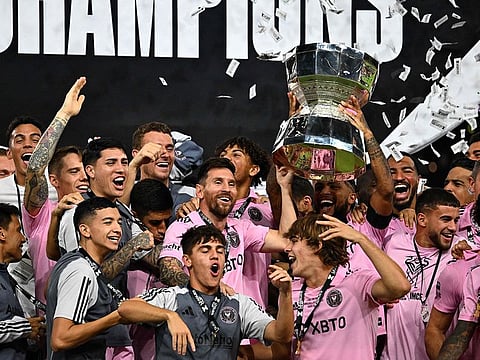 Inter Miami's Argentine forward #10 Lionel Messi and teammates celebrate with the trophy after Inter Miami won the Leagues Cup final football match against Nashville SC at Geodis Park in Nashville, Tennessee, on August 19, 2023.