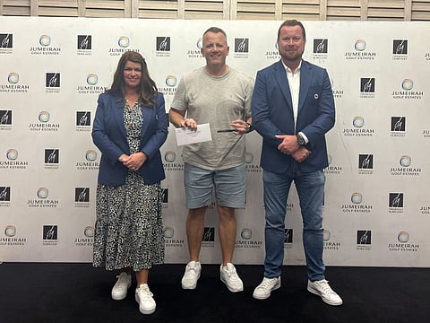 Winners Photo - Jumeirah Golf Estates Summer Open Craig Rooney (centre) with Evelyn Downham JGE Lady’s Captain and Jonathan Hall JGE Men’s Captain