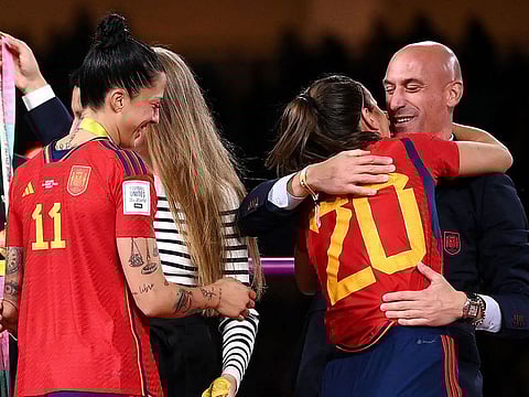 Spain's defender Rocio Galvez is congratuled by President of the Royal Spanish Football Federation Luis Rubiales (R) next to Spain's Jennifer Hermoso after winning the Australia and New Zealand 2023 Women's World Cup final football match between Spain and England at Stadium Australia in Sydney on August 20, 2023.