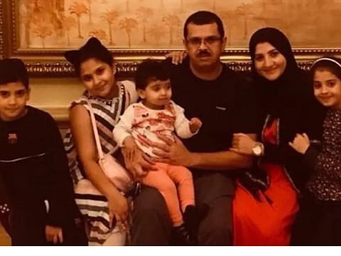 Malik Akram Kharma with his four children, Akram, Maya, Dana and Dima and wife in a file photo.