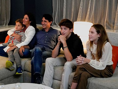 Canada's Liberal Prime Minister Justin Trudeau, accompanied by his wife Sophie Gregoire and his children Ella-Grace, Xavier and Hadrien watch the election coverage on a TV, in Montreal, Quebec, Canada, September 20, 2021