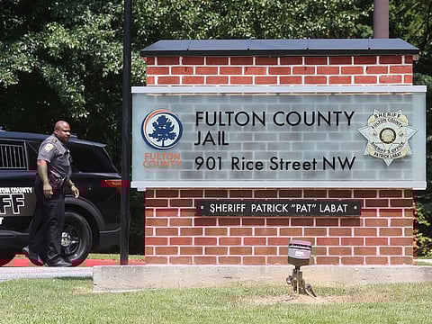 An officer guards the entrance to the Fulton County Jail in Atlanta, Georgia.