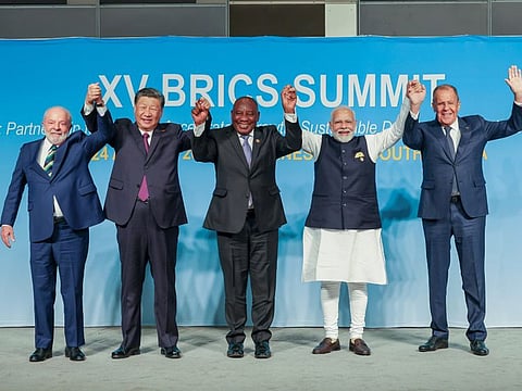 =Prime Minister Narendra Modi poses for a family photograph during the BRICS Leaders Retreat Meeting, in Johannesburg on Wednesday.