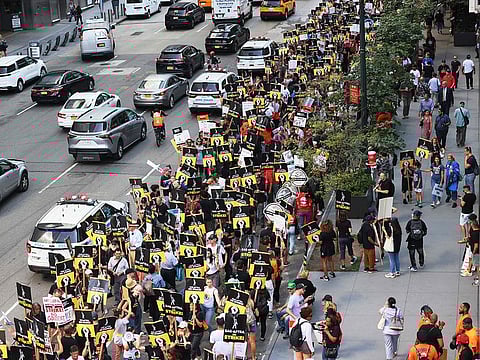 Members of SAG-AFTRA and Writers Guild of America East walk a picket line outside of the HBO/Amazon offices during the National Union Solidarity Day on August 22, 2023 in New York City.
