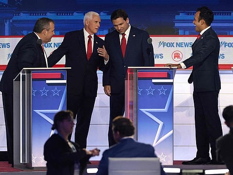 Republican presidential candidates (L-R), former New Jersey Gov. Chris Christie, former U.S. Vice President Mike Pence, Florida Gov. Ron DeSantis and Vivek Ramaswamy speak during a break in the first debate of the GOP primary season hosted by FOX News at the Fiserv Forum on August 23, 2023 in Milwaukee, Wisconsin.