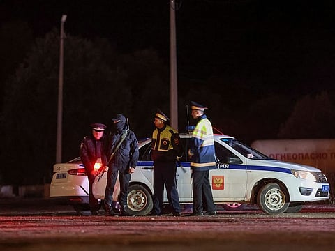 Police stand guard at a checkpoint on a road near the accident scene following the crash of a private jet linked to Wagner mercenary chief Yevgeny Prigozhin in the Tver region, Russia, August 24, 2023.