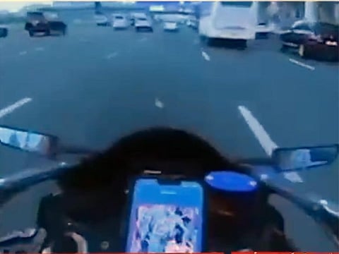 Scree grab of a video recorded by a biker doing dangerous stunts on Dubai Roads. Dubai Police arrested the biker and issued him Dh50,000 fine.