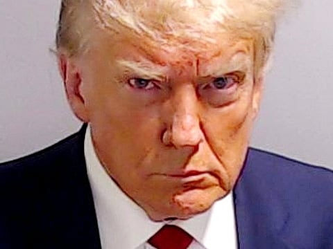 Former US President Donald Trump is shown in a police booking mugshot released by the Fulton County Sheriff's Office, after a Grand Jury brought back indictments against him and 18 of his allies in their attempt to overturn the state's 2020 election results in Atlanta, Georgia, on August 24, 2023.