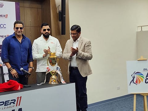 Wasim Akram and Omar Khan during the Asian Cricket Council announcing of the title sponsor for the Asia Cup at the Dubai International Stadium on Sunday.