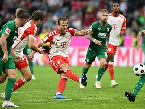 Bayern Munich's English forward Harry Kane (centre) in action during a Bundesliga match against Augsburg in Munich, southern Germany on Sunday.