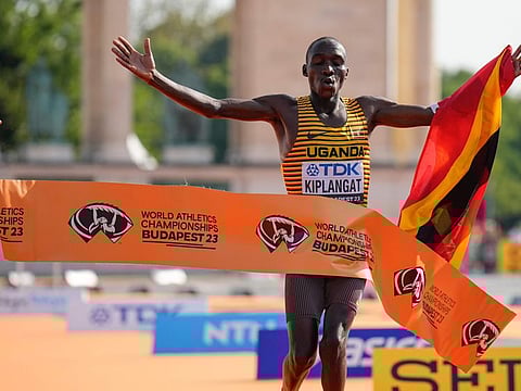Victor Kiplangat of Uganda reacts as he crosses the finish line to win the men's marathon during the World Athletics Championships in Budapest, Hungary, on Sunday.