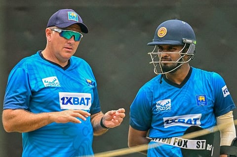 Sri Lanka's captain Dasun Shanaka (right) speaks with coach Chris Silverwood during a practice session on the eve of their Asia Cup against Bangladesh at the Pallekele International Cricket Stadium in Kandy on Wednesday.