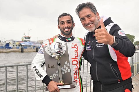 Rashid Al Qamzi with Team Abu Dhabi manager Guido Cappellini.