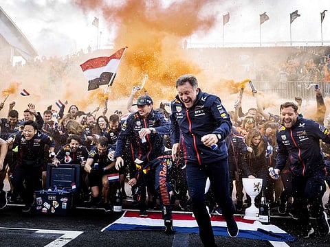 Red Bull Racing's driver Max Verstappen and Red Bull Racing's British team principal Christian Horner celebrate with the members of the Red Bull Racing team after winning the Dutch Grand Prix race at The Circuit Zandvoort, on August 27.